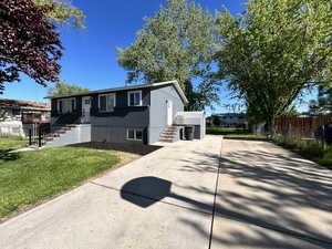 View of front of property with a front yard