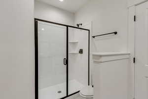 Bathroom with an enclosed shower and toilet