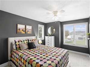 Carpeted bedroom with ceiling fan,  and multiple windows