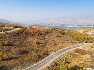 Drone / aerial view with a water and mountain view