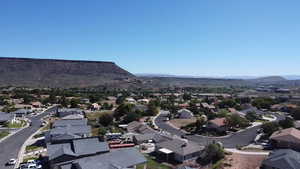 Birds eye view of property with a mountain view