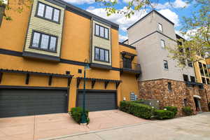 View of building exterior with a garage