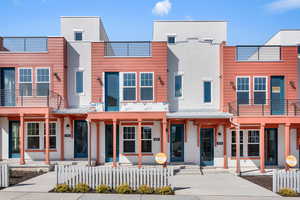 View of front of property with a balcony