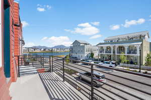 Balcony with a water and mountain view