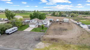 Birds eye view of property featuring a rural view