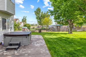 View of yard with a hot tub