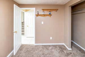 Unfurnished bedroom with tile floors and a closet