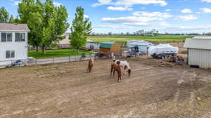 View of yard featuring a shed and a rural view