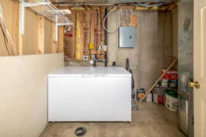 Washroom featuring hookup for an electric dryer