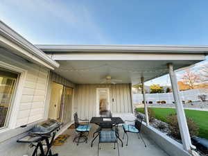 View of patio featuring ceiling fan