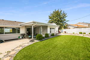 View of back of property with a patio area