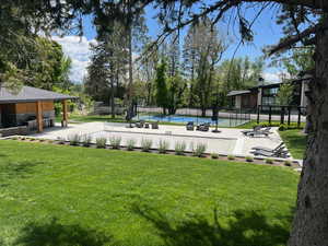 View of yard featuring a fenced in pool