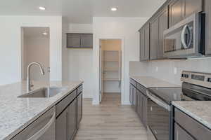 Kitchen and Walk-In Pantry*Photos of like floorplan with similar finishes