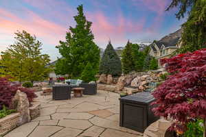 Patio terrace at dusk with outdoor lounge area