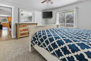 Bedroom with carpet flooring, lofted ceiling, and ceiling fan