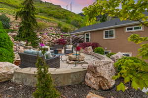 Patio terrace at dusk with an outdoor living space