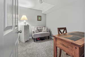 Carpeted office space featuring a textured ceiling