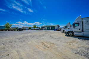 View of vehicle parking featuring a garage