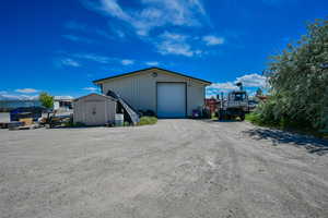 View of outdoor structure featuring a garage