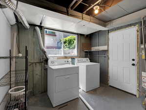 Washroom featuring washer and dryer