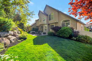 Exterior space featuring a patio and a yard