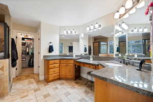 Master Bathroom with tile flooring and vanity