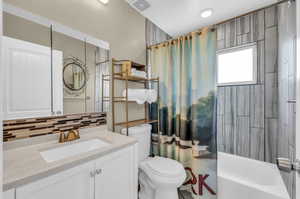 Full bathroom with shower / bathtub combination.