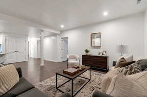 Living room with wood-type flooring