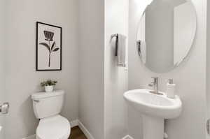 Bathroom with wood-type flooring and toilet