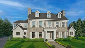 View of front of house with a front yard and a balcony