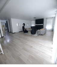 Unfurnished living room featuring light wood-type flooring