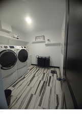 Laundry room featuring independent washer and dryer