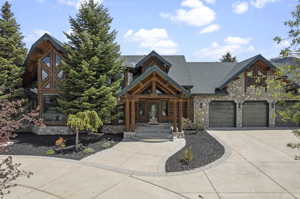 Cabin featuring a garage