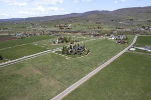 Drone / aerial view featuring a mountain view and a rural view