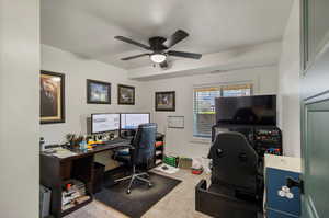 Office space with carpet flooring and ceiling fan