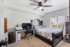 Apartment Carpeted bedroom with ceiling fan