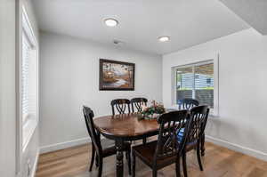 Apartment Dining area featuring light wood-type flooring