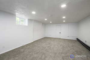 Basement featuring carpet flooring