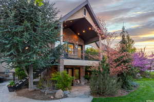 View of front of home featuring a balcony