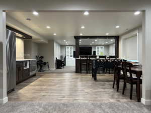 Kitchen with stainless steel appliances and hardwood / wood-style floors