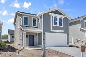 View of front of property with a garage