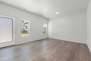 Unfurnished room with light hardwood / wood-style floors