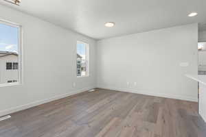 Spare room with wood-type flooring