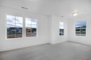 Carpeted empty room with plenty of natural light