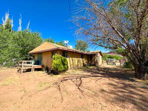 View of home's exterior with a wooden deck