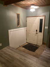 Entryway with wood ceiling, ceiling fan, and hardwood / wood-style floors