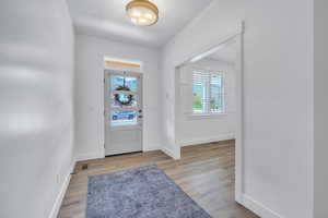 Entrance foyer featuring hardwood / wood-style floors