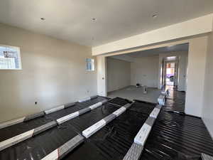 Living room with view into kitchen