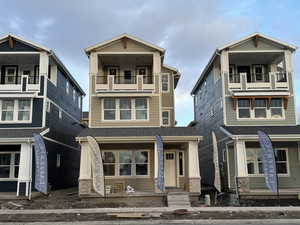 View of front of house featuring a balcony