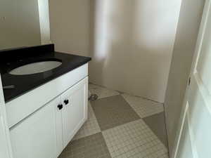 Half bathroom in entry, tile accent floor, quartz countertop